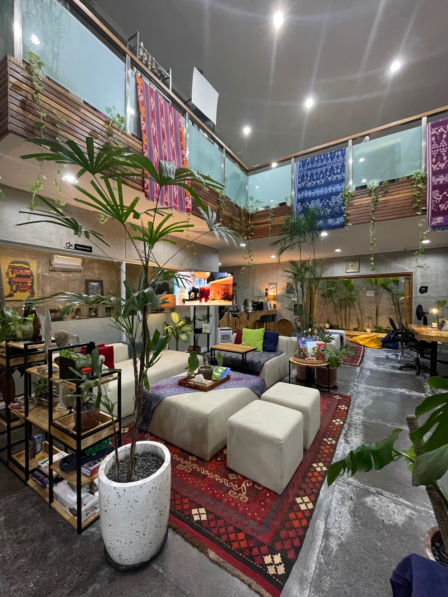 Nusantara Hub lounge with ikat textiles and plants
